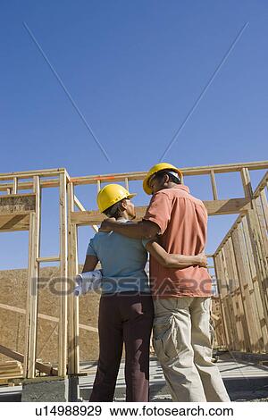 Stock Photo - Couple in construction site. Fotosearch