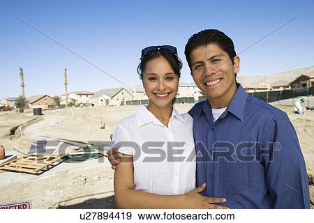 Stock Photo - Couple in construction site. Fotosearch