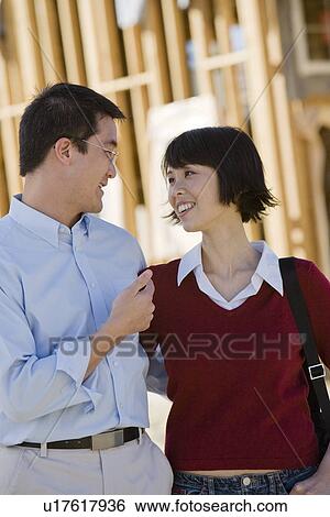 Couple in construction site View Large Photo Image Stock Photograph - Couple in construction site. Fotosearch