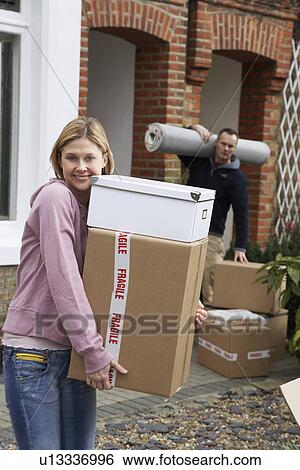 Couple moving house View Large Photo Image Stock Photograph - Couple moving house. Fotosearch