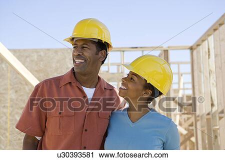 Couple on construction site View Large Photo Image Stock Image - Couple on construction site. Fotosearch