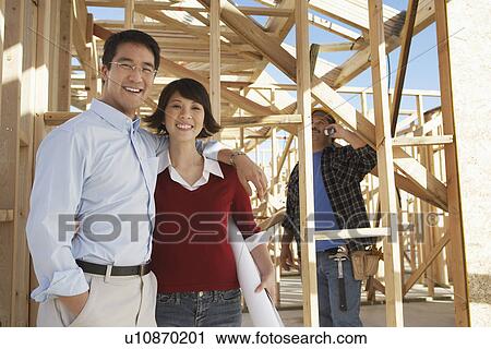 Couple on new home building site View Large Photo Image Stock Image - Couple on new home building site. Fotosearch