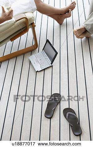 Couple relaxing on porch, view from above. View Large Photo Image Stock Photo - Couple relaxing on porch, view from above.. Fotosearch