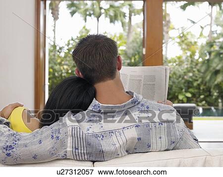 Couple Relaxing on Sofa View Large Photo Image Stock Photo - Couple Relaxing on Sofa. Fotosearch