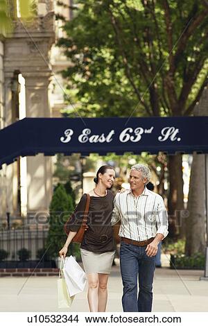 Picture - Couple walking in city. Fotosearch