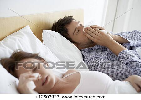 Couple with Colds Lying in Bed View Large Photo Image Stock Image - Couple with Colds Lying in Bed. Fotosearch