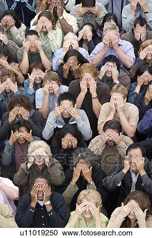 Stock Image - Crowd covering eyes. Fotosearch
