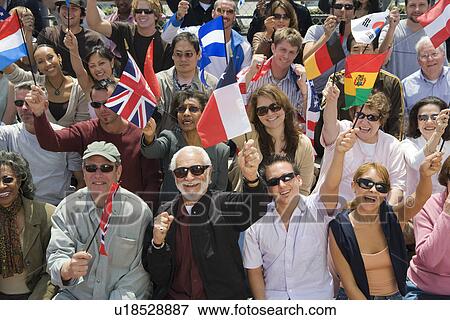 Crowd holding up National flags View Large Photo Image Stock Photo - Crowd holding up National flags. Fotosearch