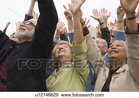 Stock Photo - Crowd of seniors celebrating . Fotosearch