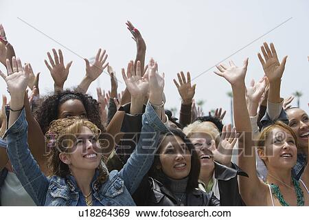 Crowd of women celebrating View Large Photo Image Stock Photo - Crowd of women celebrating . Fotosearch