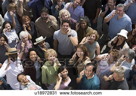 Crowd using mobile phones View Large Photo Image Stock Image - Crowd using mobile phones. Fotosearch