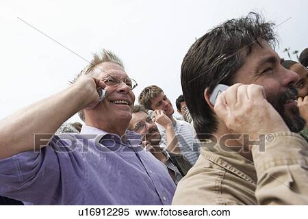 Stock Photography - Crowd using mobile phones. Fotosearch