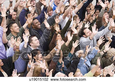 Stock Image - Crowd with arms raised. Fotosearch