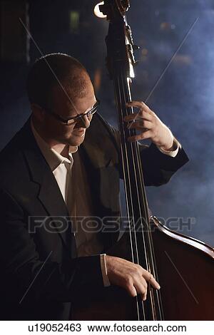 Stock Image - Double Bass Player. Fotosearch