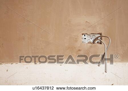 Electrical wires protruding from newly plastered wall View Large Photo Image Stock Image - Electrical wires protruding from newly plastered wall. Fotosearch