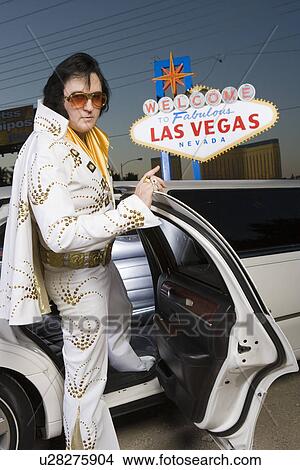 Picture - Elvis impersonator getting into limo in Las Vegas, Nevada, USA. Fotosearch