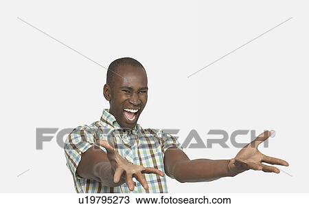 Enthusiastic Man smiling big, arms stretched out in front, palms up View Large Photo Image Stock Image - Enthusiastic Man smiling big, arms stretched out in front, palms up. Fotosearch