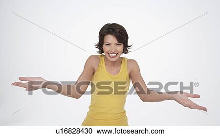 Enthusiastic woman smiling big, arms stretched out in front, palms up View Large Photo Image Stock Image - Enthusiastic woman smiling big, arms stretched out in front, palms up. Fotosearch