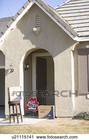 Facade of house with sold sign and few cardboard boxes View Large Photo Image Stock Image - Facade of house with sold sign and few cardboard boxes. Fotosearch