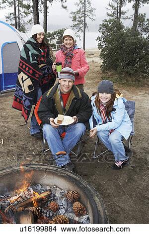 Family by campfire, (portrait) View Large Photo Image Picture - Family by campfire, (portrait). Fotosearch