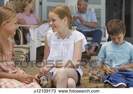 Stock Image - Family on Porch. Fotosearch