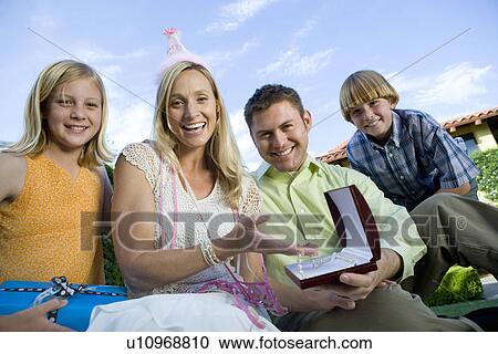 Family with two children celebrating birthday in garden View Large Photo Image Stock Image - Family with two children celebrating birthday in garden. Fotosearch