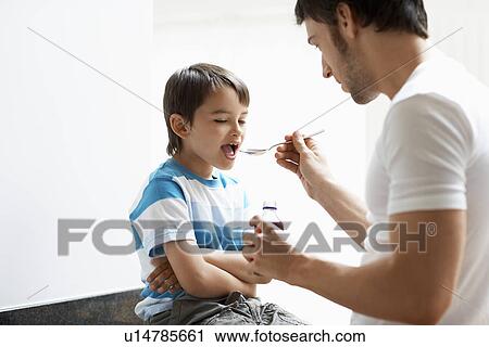 Father Giving Son Cough Syrup View Large Photo Image Stock Image - Father Giving Son Cough Syrup. Fotosearch