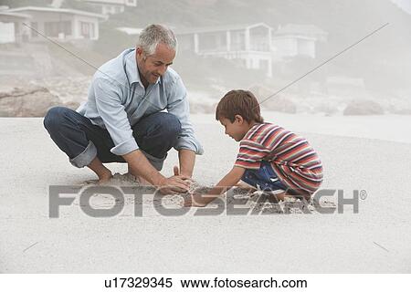 Father Playing with Son on Beach View Large Photo Image Stock Photography - Father Playing with Son on Beach. Fotosearch