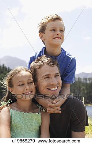 Father with Two Children Outdoors View Large Photo Image Stock Photo - Father with Two Children Outdoors. Fotosearch