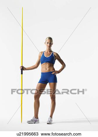 Female athlete holding javelin View Large Photo Image Stock Image - Female athlete holding javelin. Fotosearch