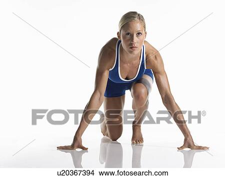 Female athlete in starting position View Large Photo Image Picture - Female athlete in starting position. Fotosearch