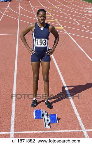 Female athlete next to starting block, ready to run View Large Photo Image Stock Image - Female athlete next to starting block, ready to run. Fotosearch