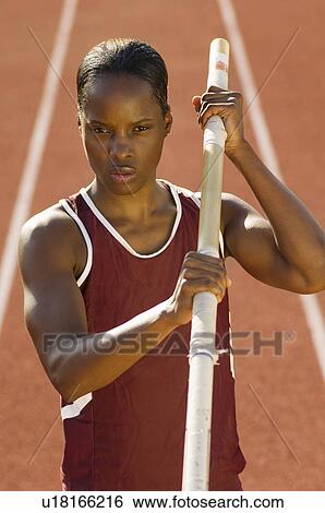Female athlete preparing for pole jump View Large Photo Image Stock Photograph - Female athlete preparing for pole jump. Fotosearch
