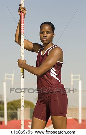 Female athlete preparing for pole jump View Large Photo Image Stock Photography - Female athlete preparing for pole jump. Fotosearch