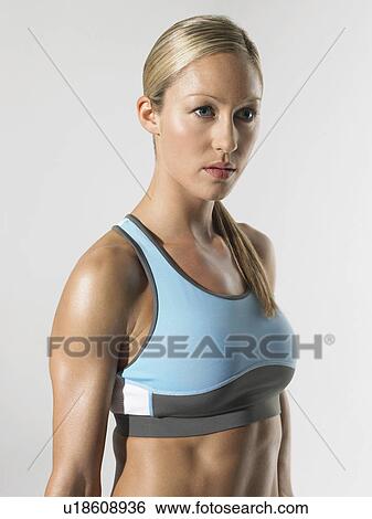 Stock Photograph - Female athlete standing, portrait. Fotosearch