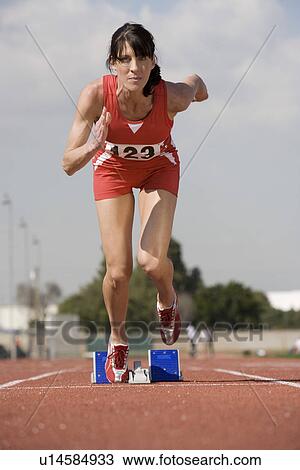 Female athlete starting to run View Large Photo Image Stock Image - Female athlete starting to run. Fotosearch