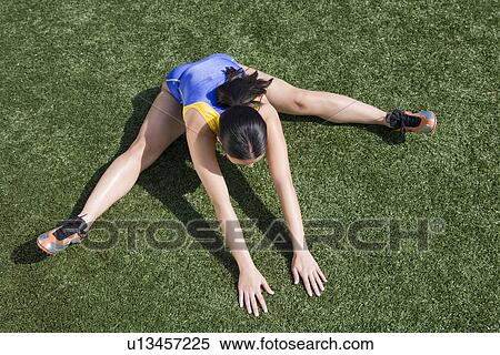 Female athlete stretching View Large Photo Image Stock Photography - Female athlete stretching. Fotosearch