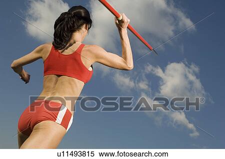 Female athlete throwing javelin View Large Photo Image Stock Photography - Female athlete throwing javelin. Fotosearch