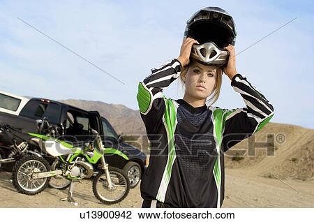 Female motocross racer in desert, (portrait) View Large Photo Image Stock Image - Female motocross racer in desert, (portrait). Fotosearch