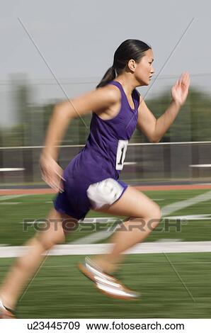 Female track athlete sprinting View Large Photo Image Stock Photo - Female track athlete sprinting. Fotosearch