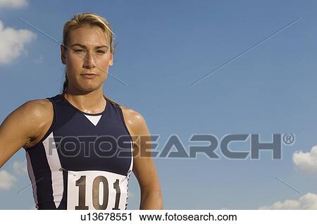 Female track athlete standing View Large Photo Image Stock Image - Female track athlete standing. Fotosearch