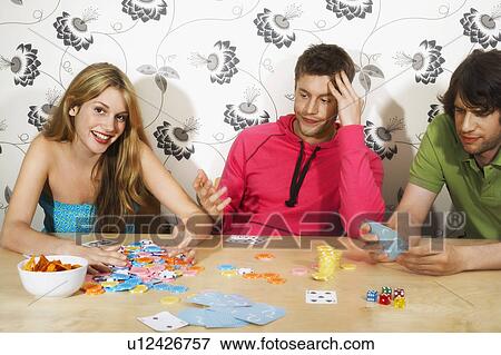 Friends Playing Cards, woman winning hand View Large Photo Image Stock Photo - Friends Playing Cards, woman winning hand. Fotosearch
