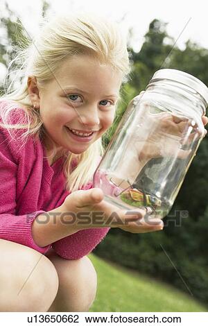 Girl Showing Insect in Jar View Large Photo Image Stock Image - Girl Showing Insect in Jar. Fotosearch