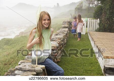 Girl with Butterfly Net in Garden View Large Photo Image Stock Photography - Girl with Butterfly Net in Garden. Fotosearch