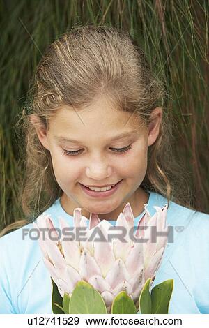 Stock Photo - Girl with Flower. Fotosearch