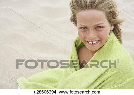 Picture - Girl Wrapped in Towel at Beach. Fotosearch