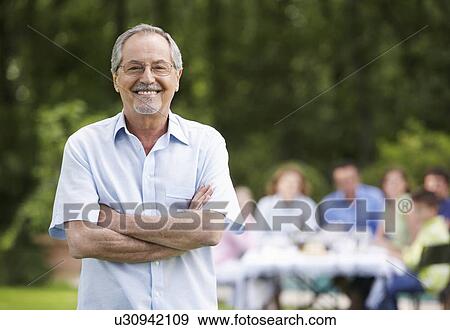 Grandfather and Family in Garden View Large Photo Image Stock Photo - Grandfather and Family in Garden. Fotosearch
