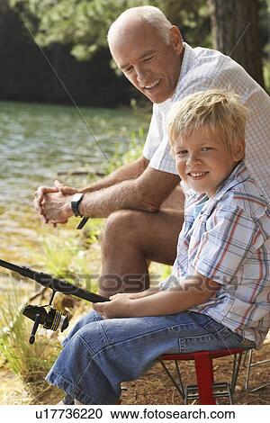 Stock Image - Grandfather and Grandson Fishing. Fotosearch