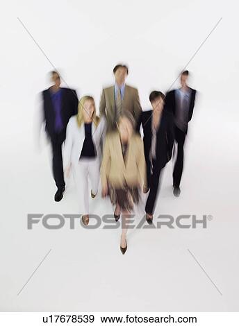 Group of businesspeople walking, blurred effect View Large Photo Image Stock Photo - Group of businesspeople walking, blurred effect. Fotosearch