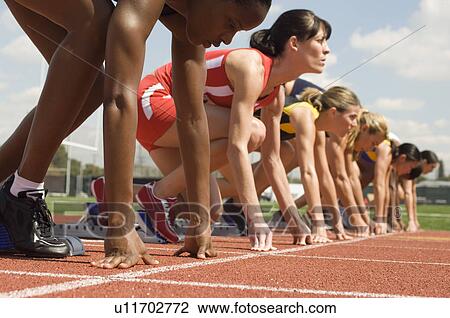 Group of female track athletes on starting blocks View Large Photo Image Stock Image - Group of female track athletes on starting blocks. Fotosearch